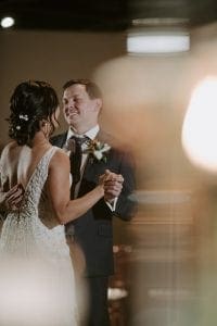 Bride and groom kissing during their private last dance during their reception in Marie Gabrielle