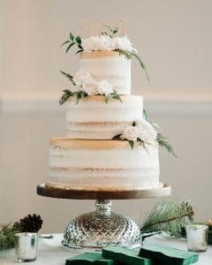 Three layer naked cake for the bride at the wedding reception